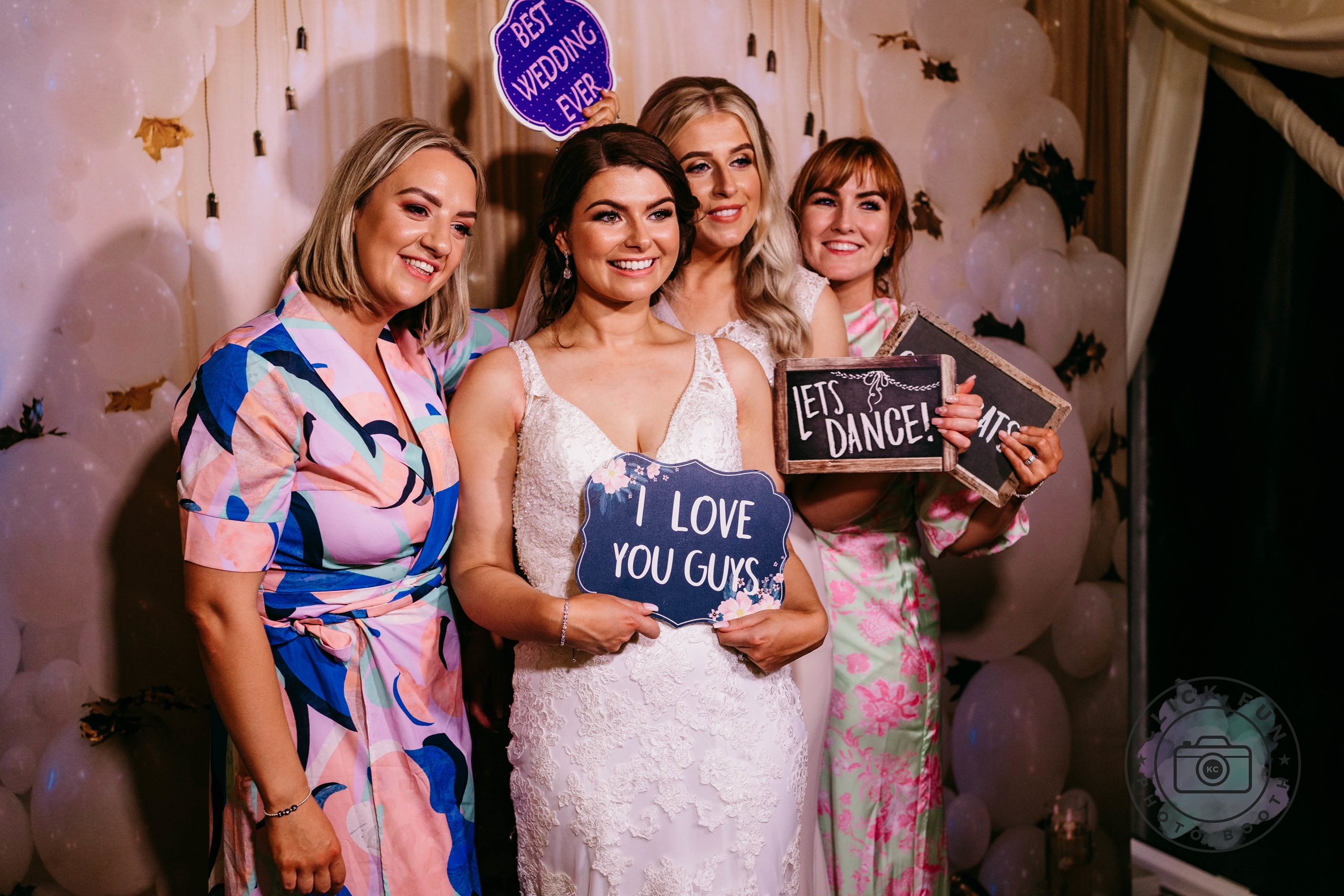 Group of women in blue dresses posing together