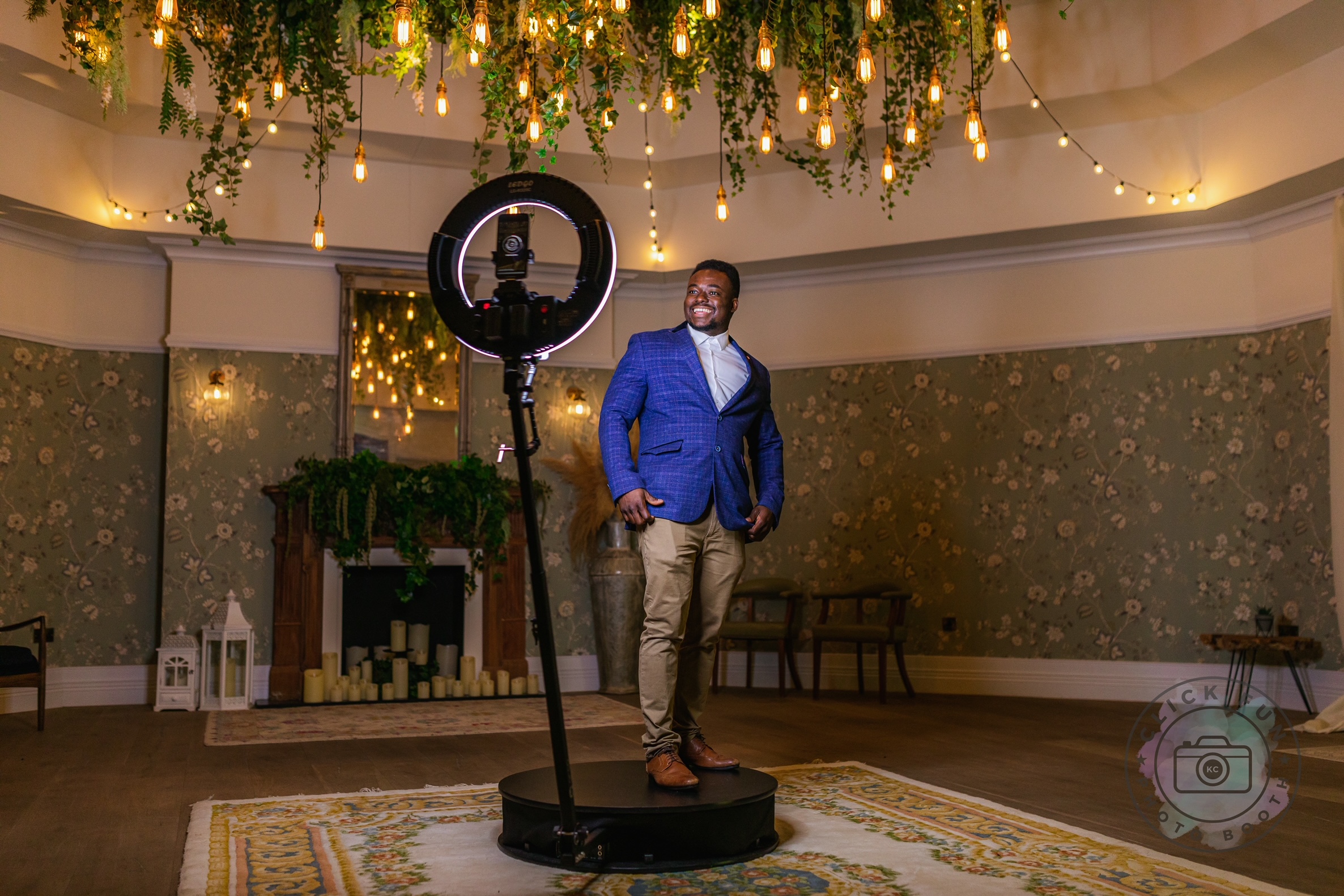 Person standing on a 360 photo booth platform