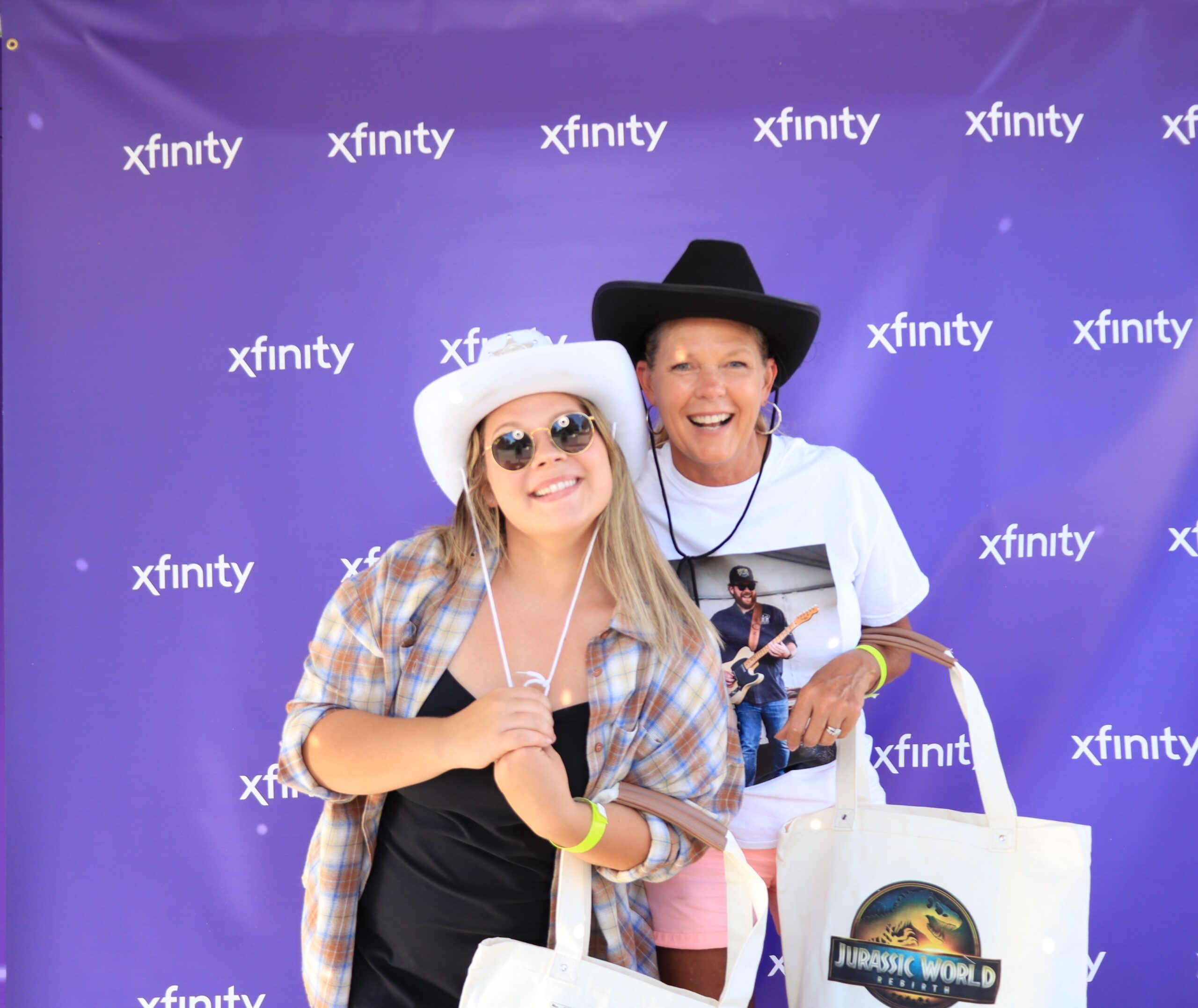 Couple wearing cowboy hats posing for a photo