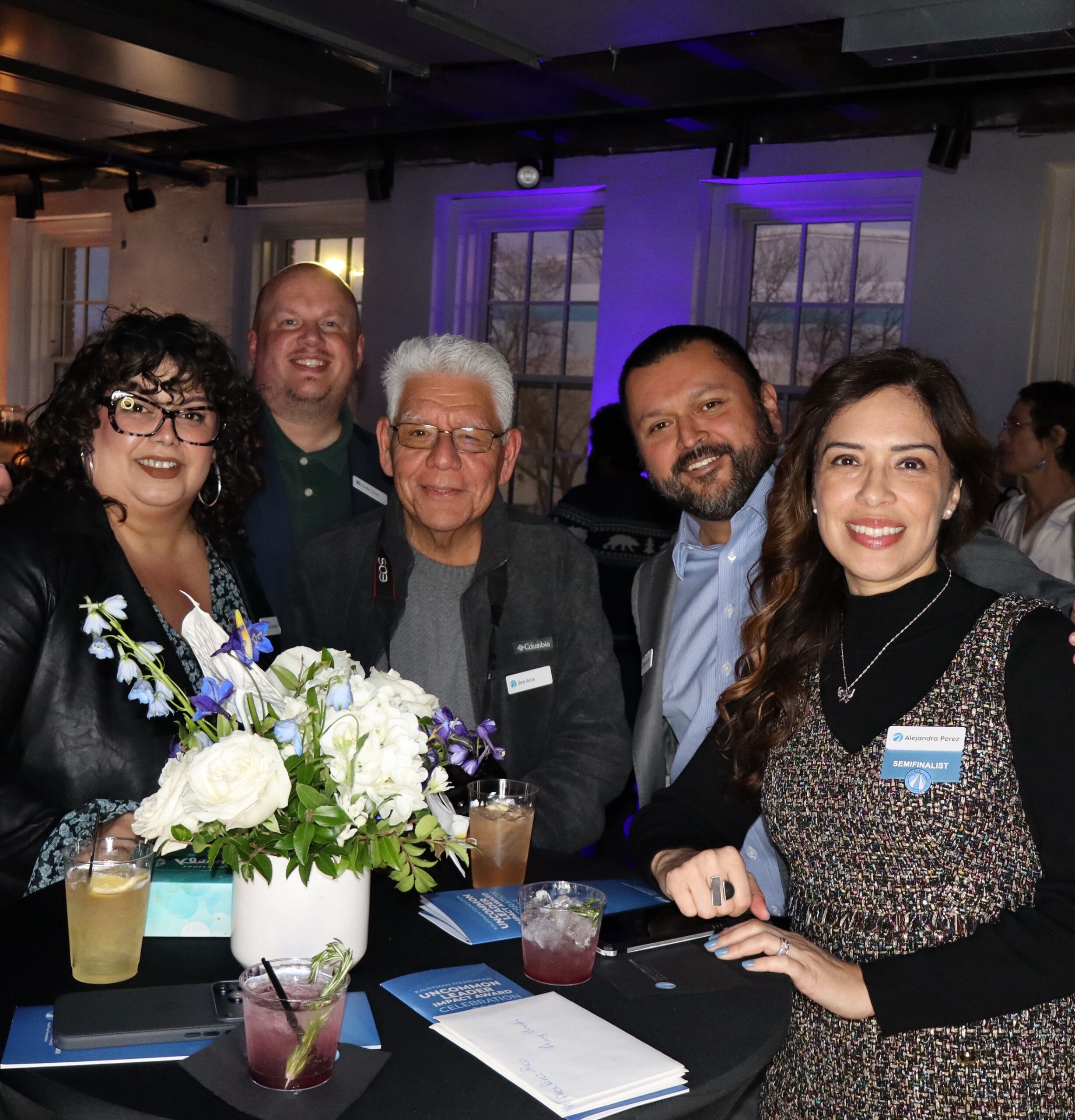 Group of people posing together at an event