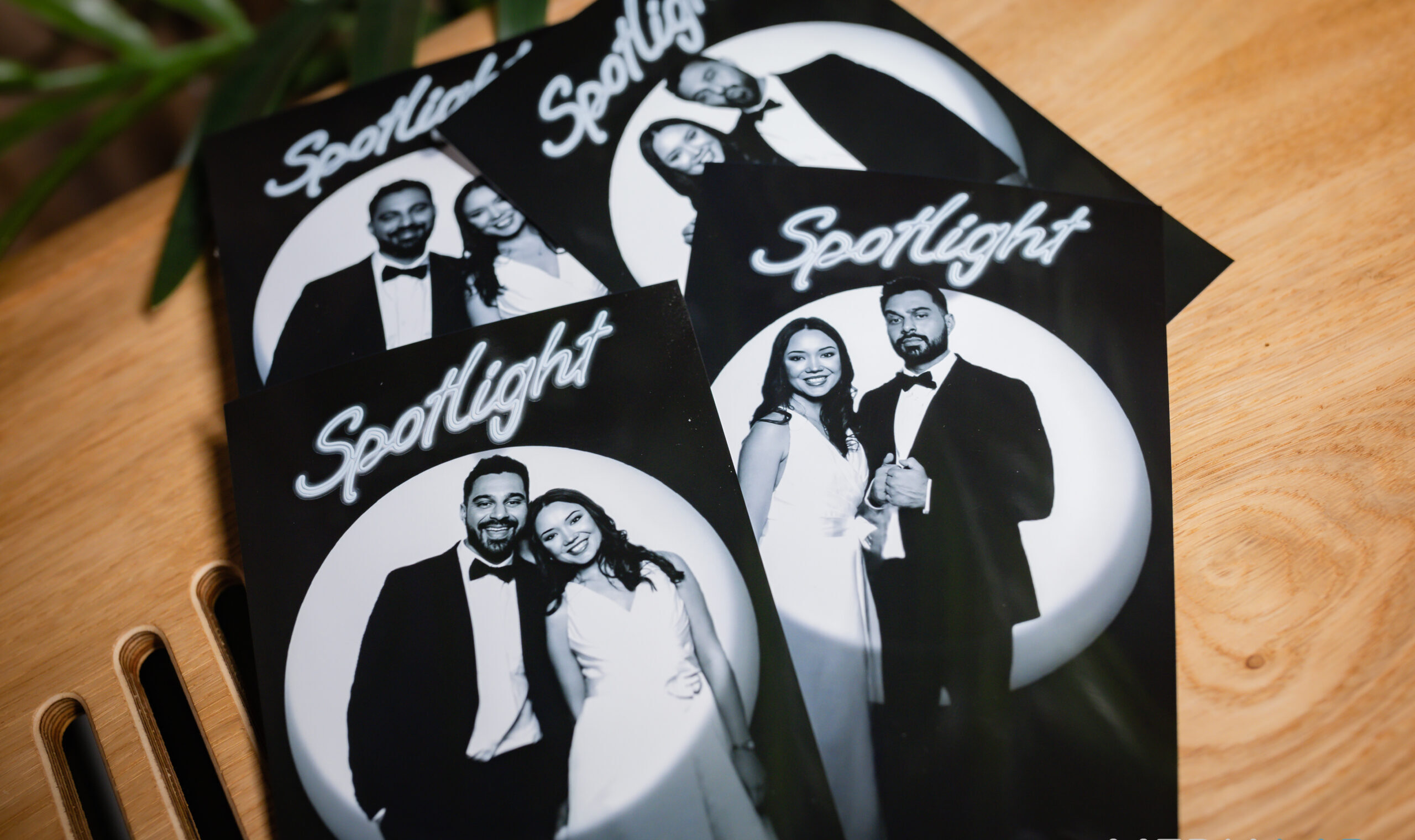 Black and white wedding photo booth print of a couple embracing