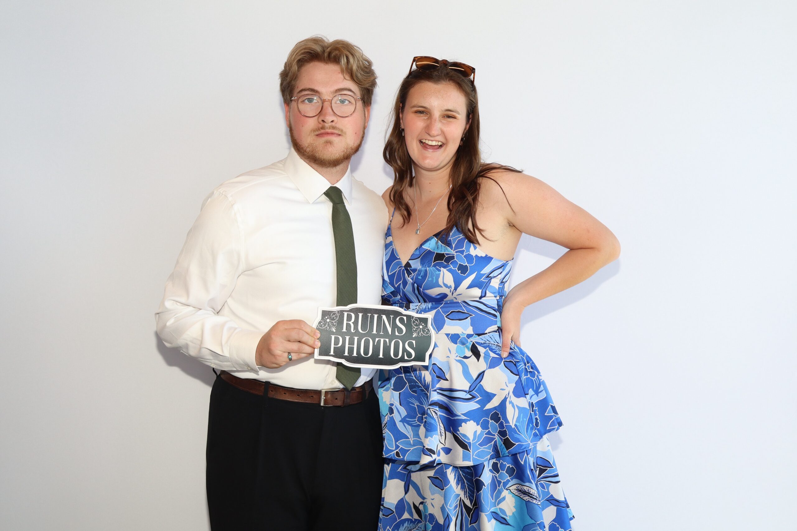 Man and woman posing together in formal attire