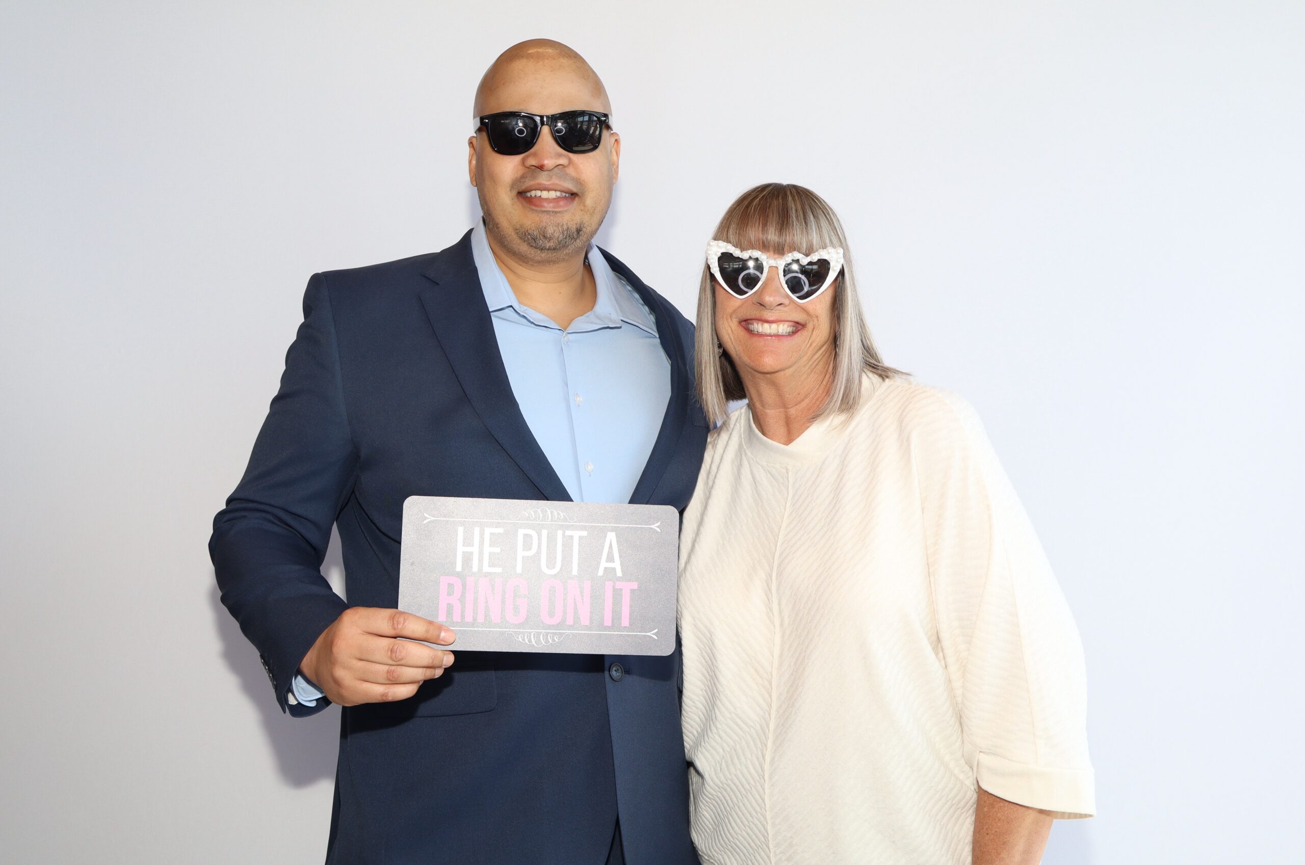 Man and woman posing together in formal attire