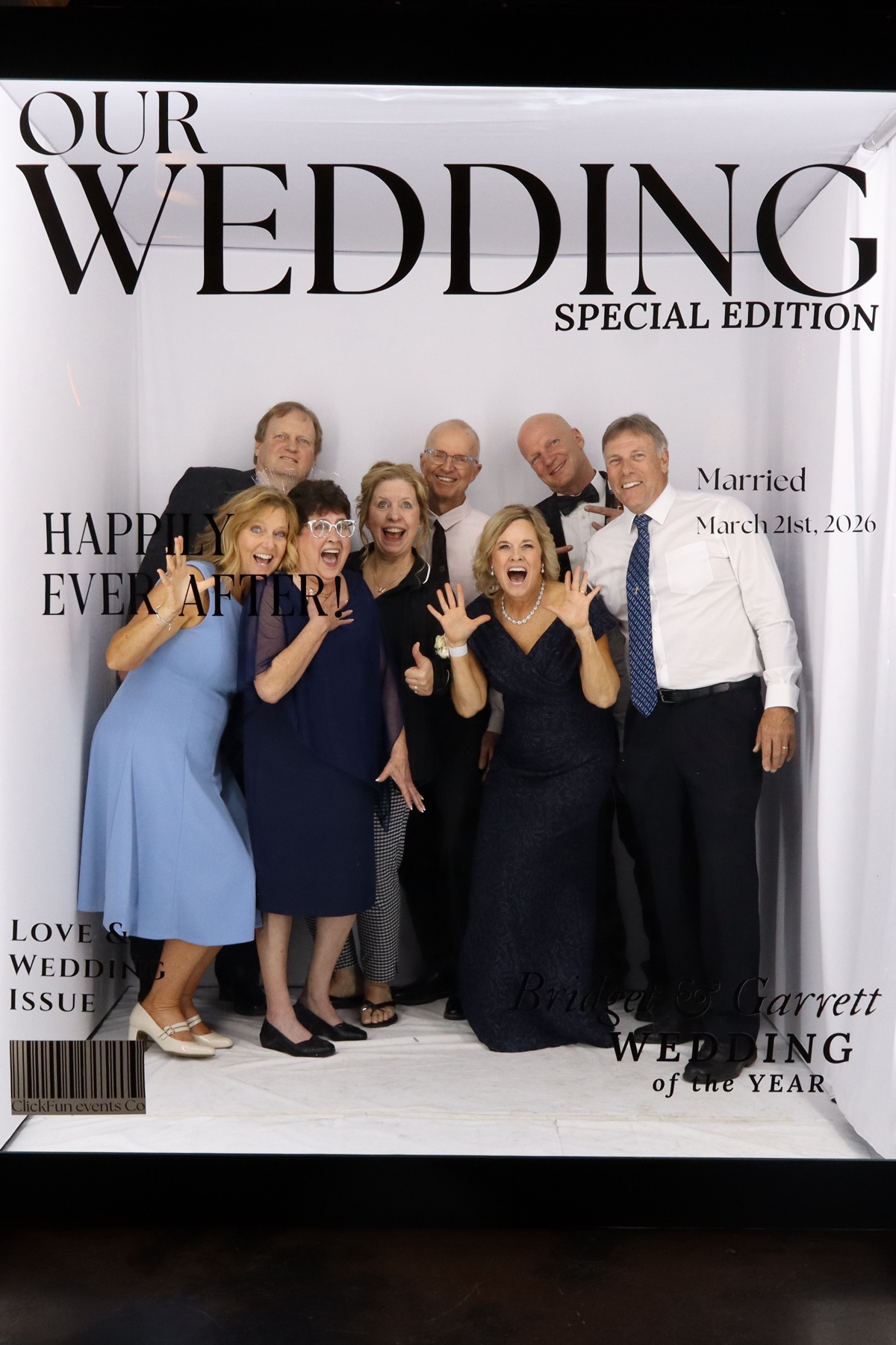 Group of women posing together at a wedding photo booth