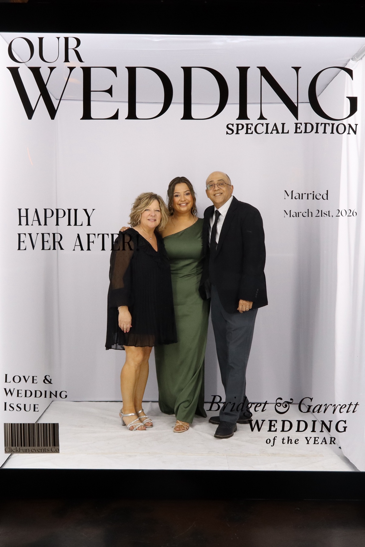 Group of people posing together at a wedding photo booth