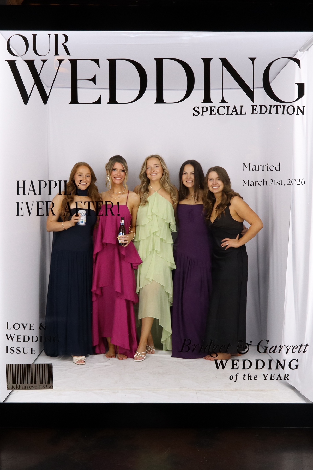 Group of women posing together at a wedding photo booth