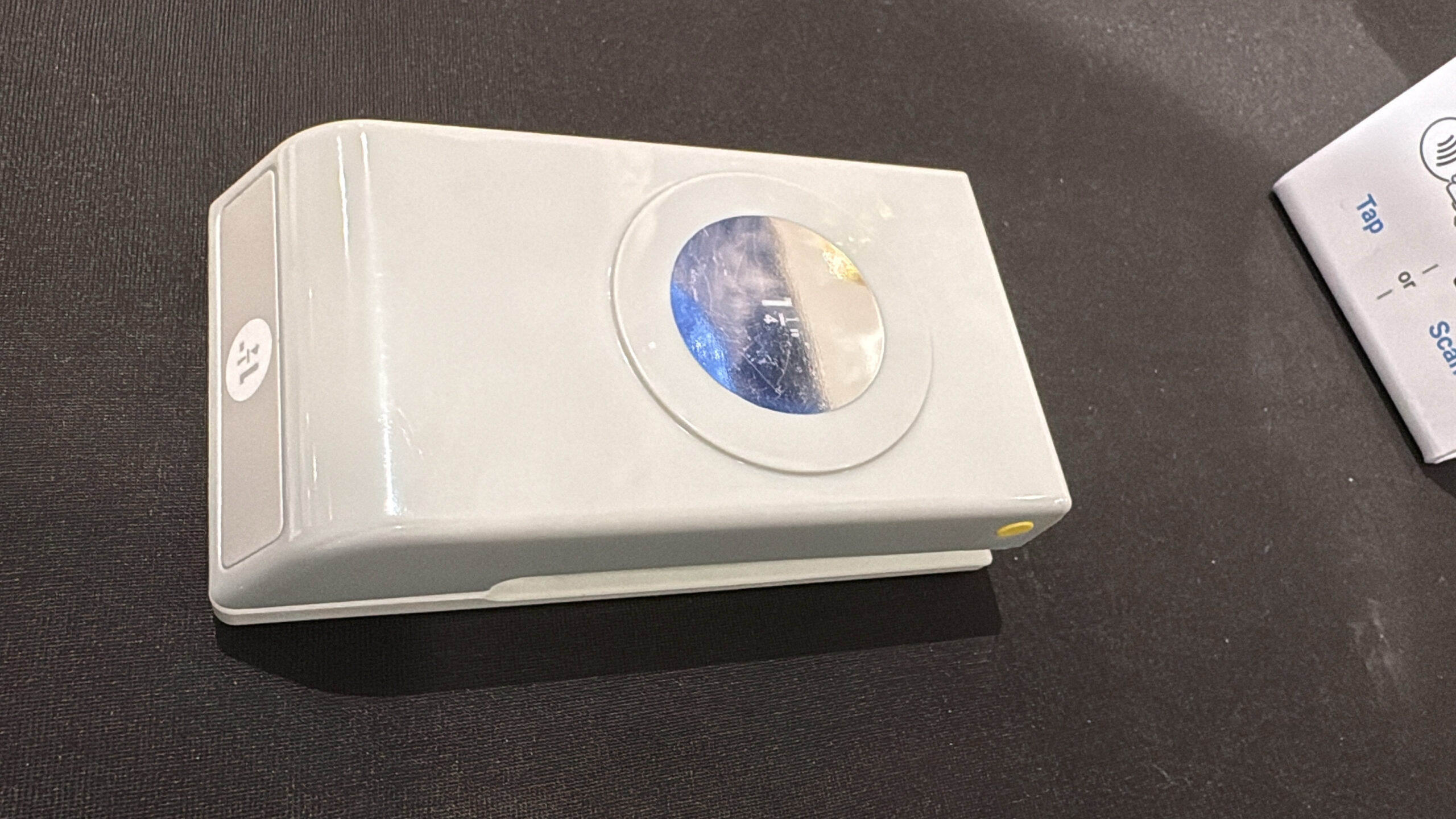 White compact or device on a light surface