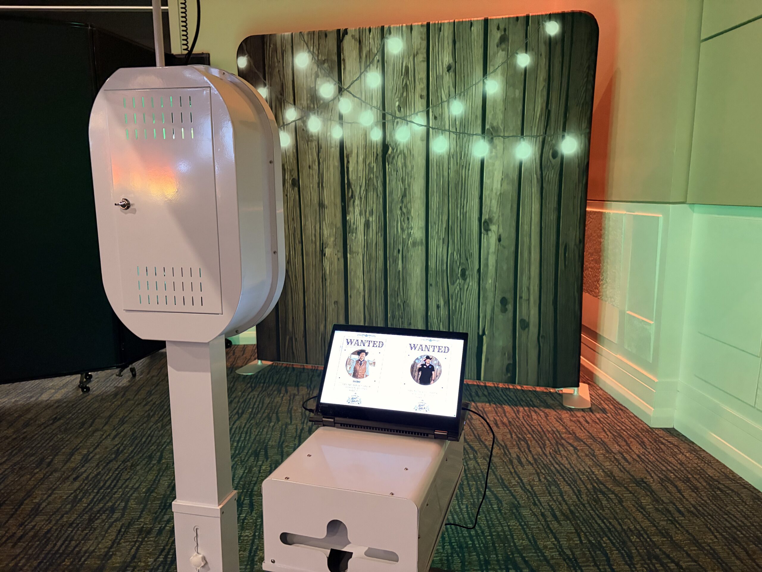 Photo booth kiosk station set up outdoors at dusk