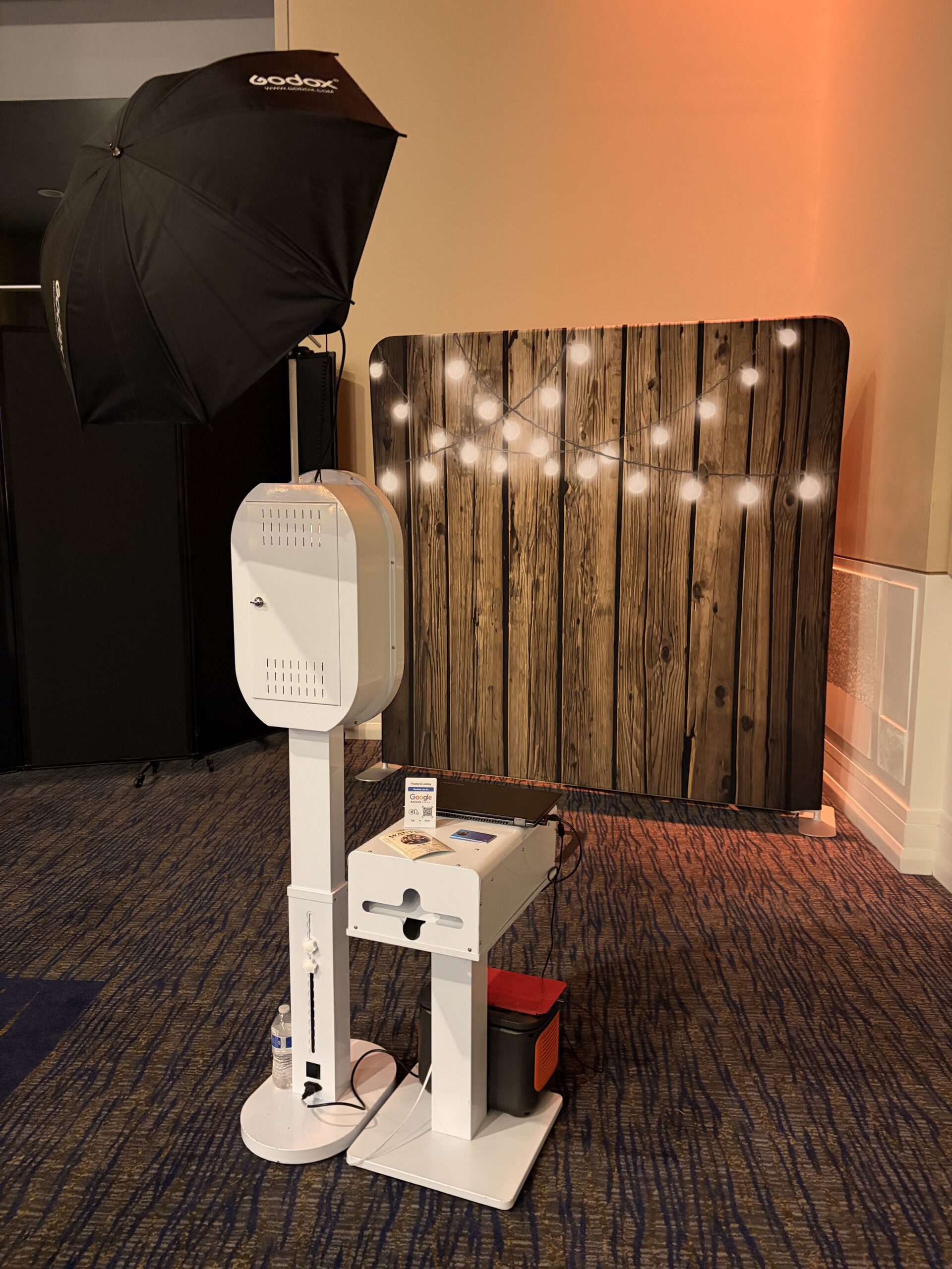 Photo booth kiosk station set up at an event