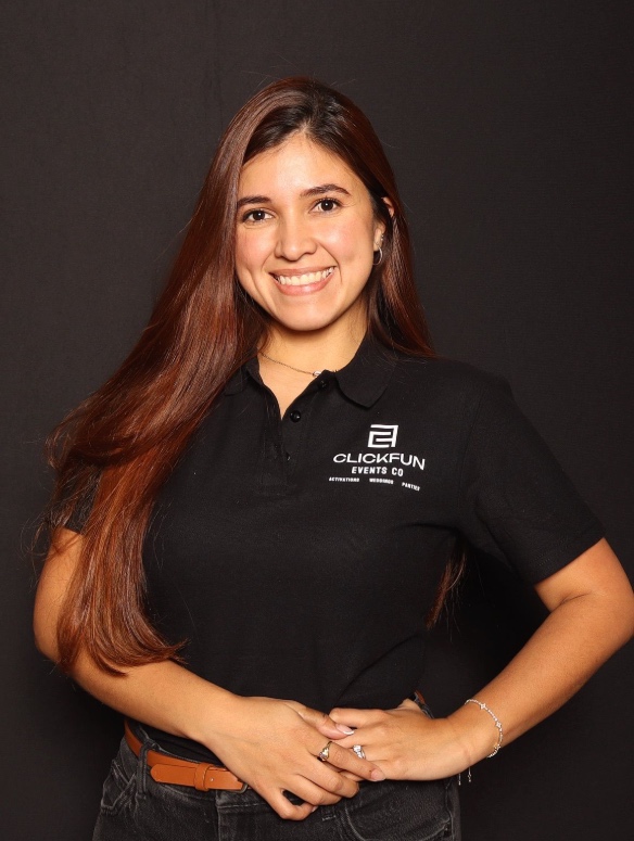 Woman smiling in a black polo shirt 